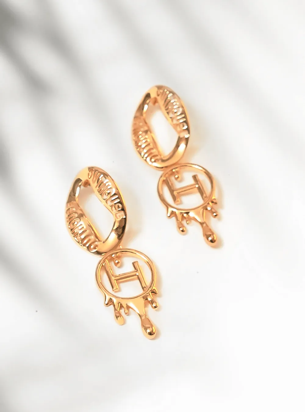 Drip OH Loop Earrings In Gold Finish