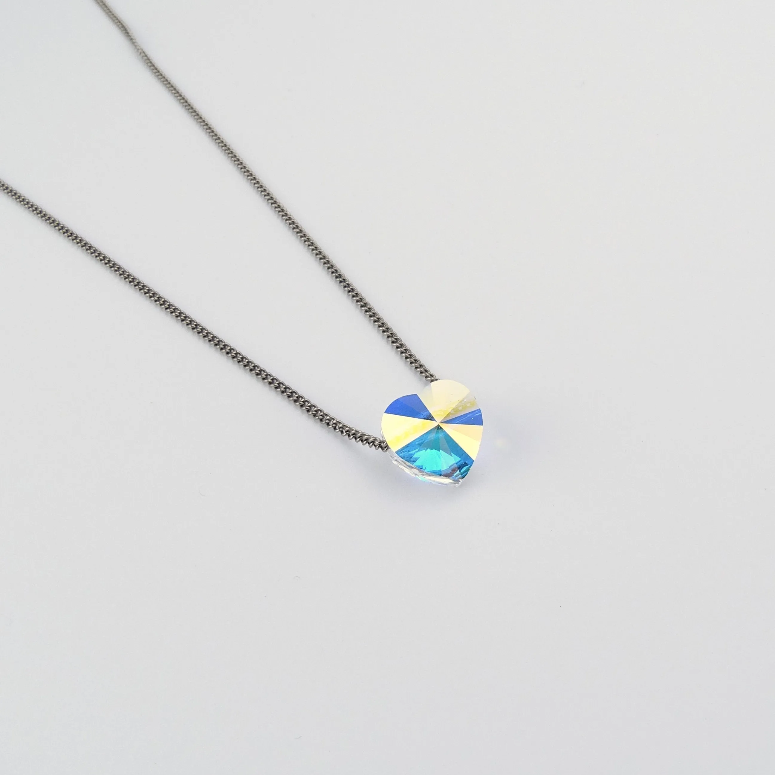 Titanium Necklace with Floating Aurora Borealis Crystal Heart Bead