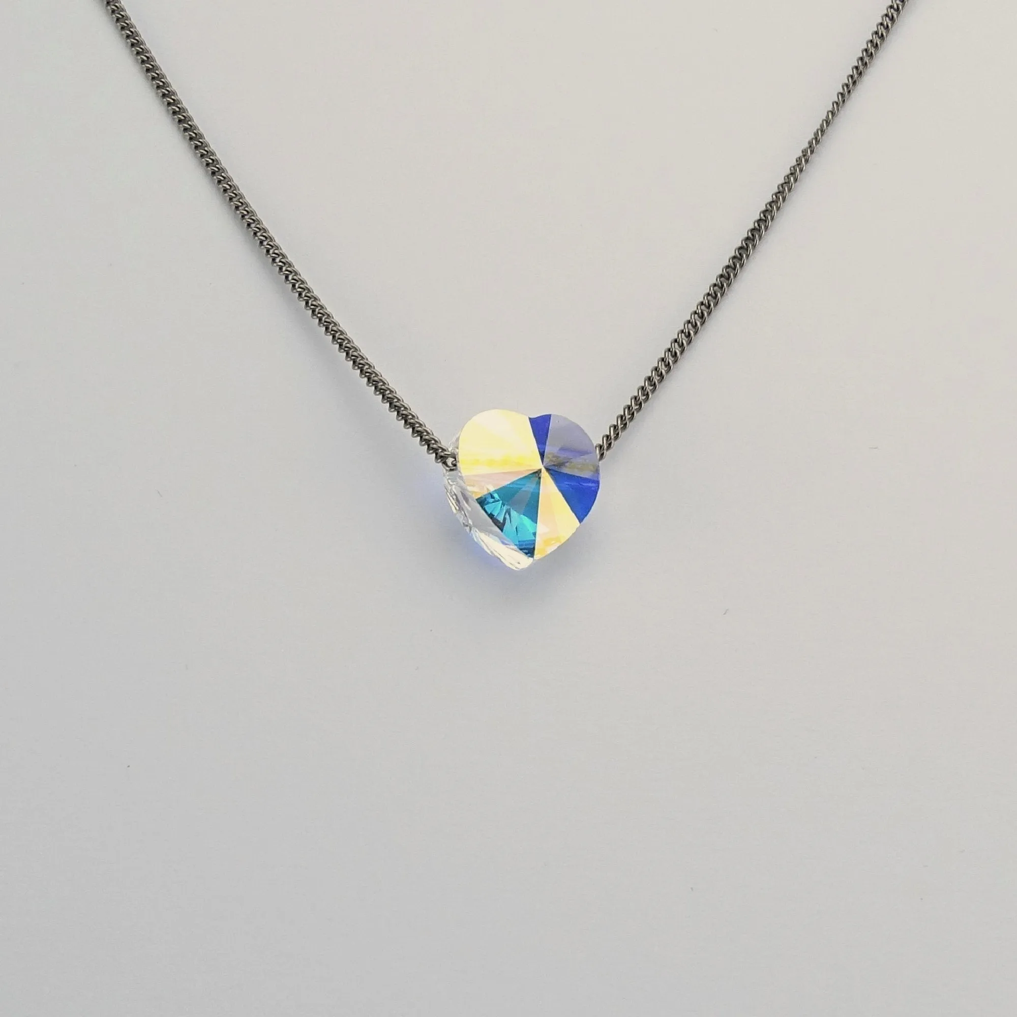 Titanium Necklace with Floating Aurora Borealis Crystal Heart Bead