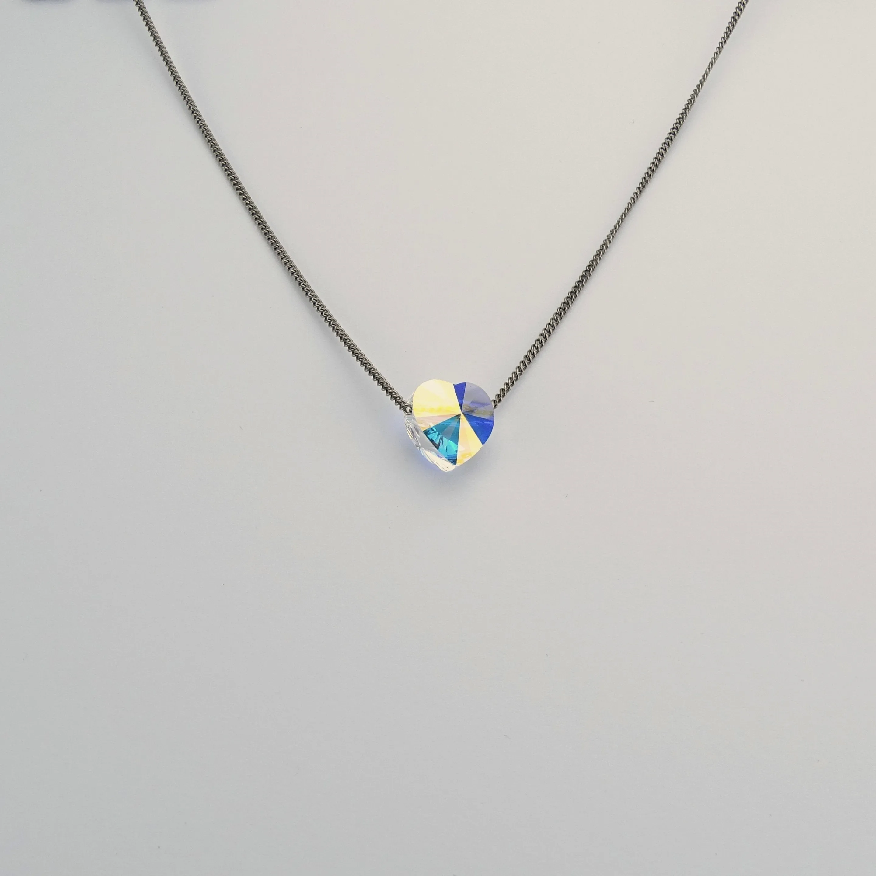Titanium Necklace with Floating Aurora Borealis Crystal Heart Bead